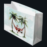 Tropisk Beach-julklapp Handflatan Träd Santa Hammo<br><div class="desc">Den här julklappen har en uppmjukning av Jultomten i en hammock mellan två handflatan träd. Perfekt för att slå in dina gåvor på en strandjul.</div>