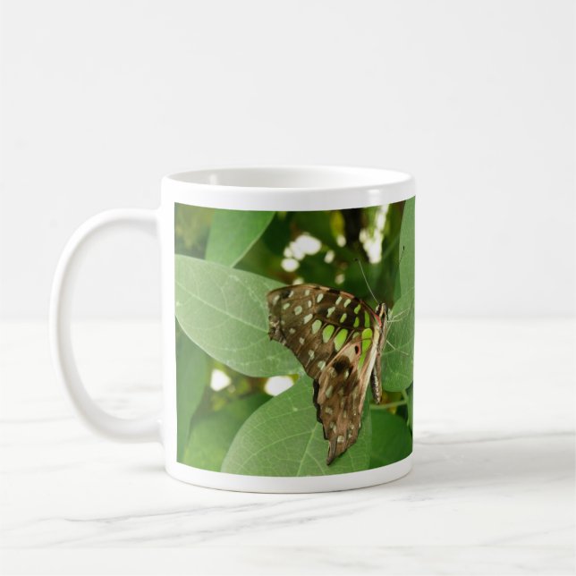Tropisk iriserande grön fjärilsmugg kaffemugg (Vänster)