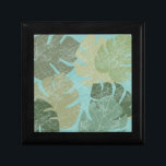 Tropiska Löv Minnesask<br><div class="desc">"Faded Tropical Lövs II" av Jade Reynolds. Innehåller en samling tropiska löv i ett fäst mönster.</div>