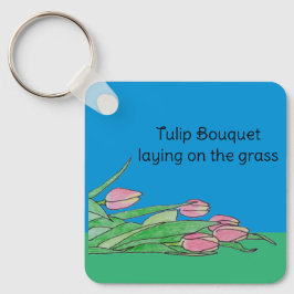 Tulpanbukett som ligger på gräset nyckelring