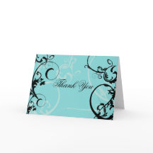 Turkos med svart virvlande utsmyckning