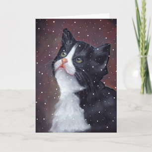 Tuxedokatt som tittar upp på snöflingor, konst helgkort