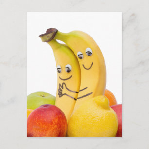 Två älska bananer med ögon och munnen vykort