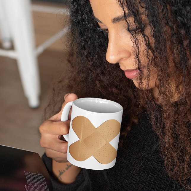 Två bandhjälpmedel kaffemugg (Skapare uppladdad)