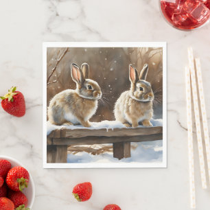 Två Cute Bunny-kaniner på en bench i Snö Pappersservett