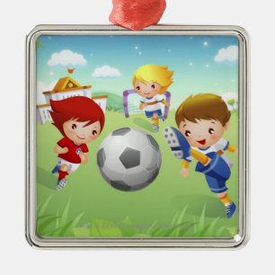 Två flickor och en pojke som leker fotboll julgransprydnad metall