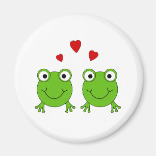 Två gröna grodor med röda hearts. magnet