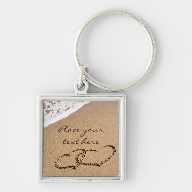 Två hörningar i handboken fyrkantig silverfärgad nyckelring (Framsidan)