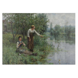 Två kvinnor som fiskar på Grass vid floden