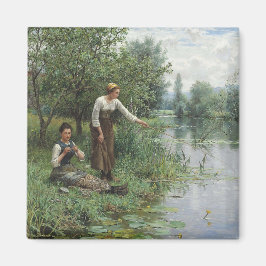 Två kvinnor som fiskar på Grass vid floden Magnet