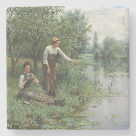 Två kvinnor som fiskar på Grass vid floden Stenunderlägg