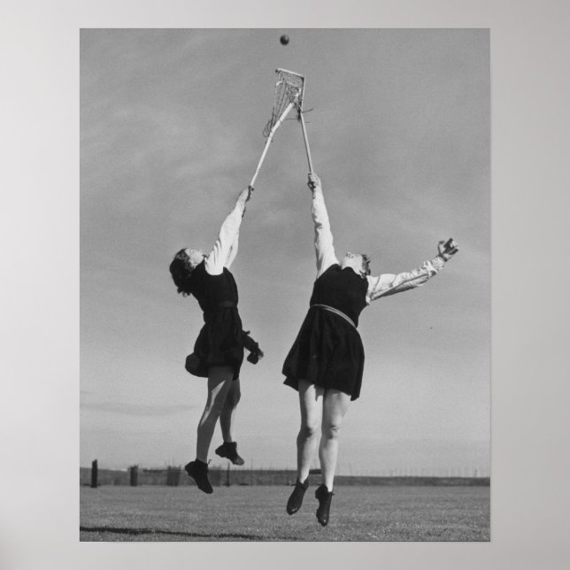 Två lacrosse-spelare hoppar till boll. poster (Framsidan)