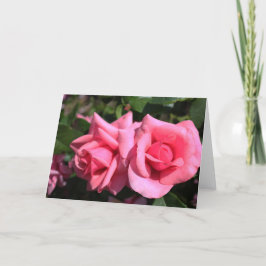 två perfekter blommor från shock rosa ro. kärlek helgkort