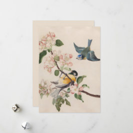 Två små fåglar nära en gren av äppelets blommar. julkort