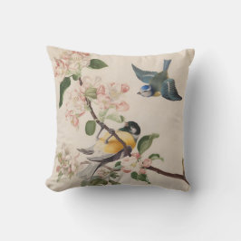 Två små fåglar nära en gren av äppelets blommar. kudde