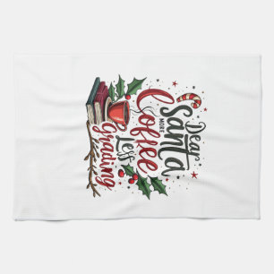 Tvättbjörn som bär jultomtehatt och jul kökshandduk
