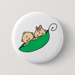 Tvilling- pojke och flicka i ärtapod knapp