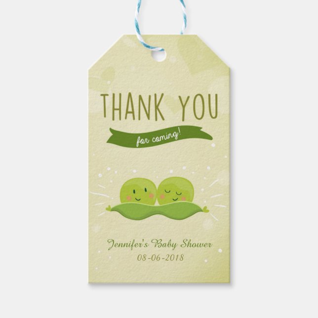 Tvillingbabyskor Två ärtor i en märkre för gåva i  Presentetikett (Framsidan)