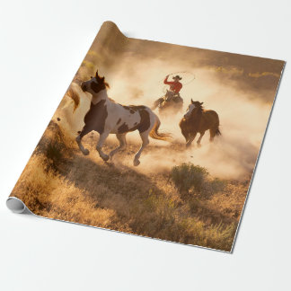 Two western cowboys riding horses, roping wild hor presentpapper