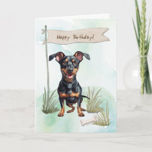 Tysk Pinscher-Hund utomhus under födelsedagsskylt Kort