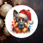 Tyska Shepherd-Hund i jultomten Runt Klistermärke<br><div class="desc">Om du kärlek tyska shepherds och vill ha söta julklistermärken,  så kör du! Cute Vattencolor stil ai art German Shepherd i Santa Hat.</div>