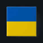 Ukraina Flagga Knapp<br><div class="desc">Det ukrainska flagga är en vågrät bicolor. Den använda färgen i flagga är blå,  gult. Andelen ukrainska flagga är 2:3. Ukrainas Flagga antogs 1992. Den första användan i den nuvarande flagga var 1848. Den senaste ändringen av den nuvarande utformningen av den ukrainska flagga gjordes 1918.</div>