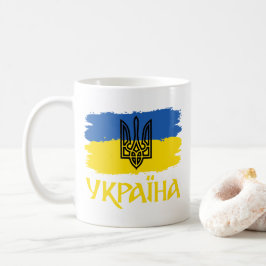 Ukrainas flagga och jackande av arm kaffemugg