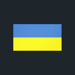 Ukrainska flaggan, Ukrainska Слава Україні Slava U Canvastryck<br><div class="desc">Ukrainas flags färger, blå och gul, har under århundraden vajat över en mark rik på historia och anda. Blått representerar den stora ukrainska himlen, medan gult symboliserar de gyllene vetefälten som sträcker sig över dess bördiga slätter. Denna enkla men kraftfulla symbol har blivit en ledstjärna för hopp och motståndskraft för...</div>