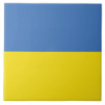 Ukrainska flaggan, Ukrainska Слава Україні Slava U Kakelplatta<br><div class="desc">Ukrainas flags färger, blå och gul, har under århundraden vajat över en mark rik på historia och anda. Blått representerar den stora ukrainska himlen, medan gult symboliserar de gyllene vetefälten som sträcker sig över dess bördiga slätter. Denna enkla men kraftfulla symbol har blivit en ledstjärna för hopp och motståndskraft för...</div>