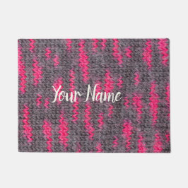 Ullstruktur i sticka med rosa och grått färg