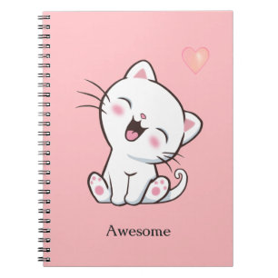 Underbar söt liten katt på ljusrosa anteckningsbok