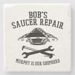 underlägg med Bob Saucer Repair logotyp