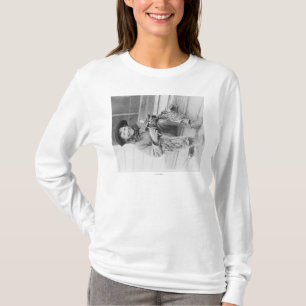 Ung pojke som kläs som Cowboy med leksaker Tee Shirt