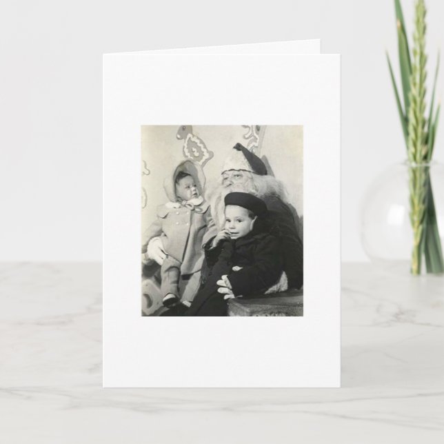 UNGAR SOM SITTER PÅ SANTAS VARV FÖR JULAFTON HELGKORT (Framsida)