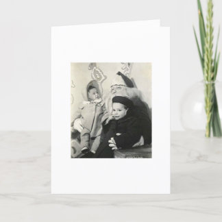 UNGAR SOM SITTER PÅ SANTAS VARV FÖR JULAFTON HELGKORT