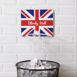 Union Jack Flagga med Funny Quote Mini-Basketkorg<br><div class="desc">Den färgstarka röda, vita och blå flaggan Union Jack från Storbritannien som visas här med ett lustigt ordcitat, "Bloody helvetet", gör att ett samtal startar för ditt kontor eller hemunderhållande. Ordet blodigt.. är en korruption av Guds blod, en fras som användes så långt tillbaka som 1700-talet... helvetet tillkom senare. Detta...</div>