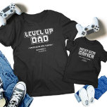 Uppgradera matchning mellan Pappa och underordnade T Shirt<br><div class="desc">Vi firar det ultimata spelbandet med våra "Gamer Pappa och Next Gen Player" som matchar t-shirts! De här skjortorna är perfekter för Fars dag, födelsedagar eller andra spelevenemang. De har återdesignerna "Nivå upp Pappa" och "Nästa spelspelare". Visa din delade passion med fet, pixelbaserad grafik. De här garantierna är idealiska för...</div>