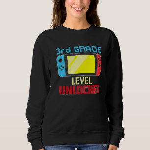 Upplåsning av videospelaren på tredje Klass-nivå i T Shirt