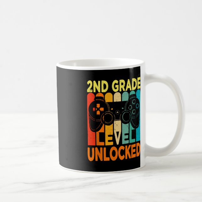 Upplåst videospel på andra Klass-hejen tillbaka ti Kaffemugg (Höger)