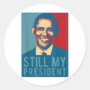 USA: s presidentval T Shirt Obama är fortfarande m Runt Klistermärke