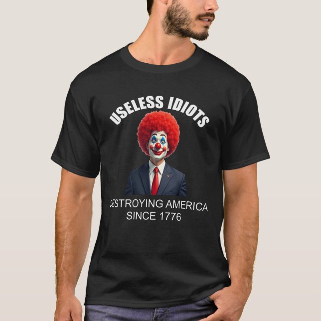 Useless Idiots Policy Politikar Funny T Shirt (Framsida)