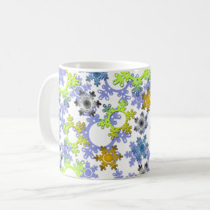 Utskära papperssnöflingor flerfärgade på vitt kaffemugg