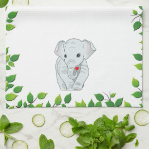Vacker anpassningsbar elefant och gröna blad på vi kökshandduk
