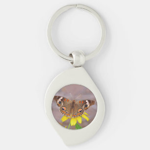 Vacker fjäril på gul blomma swirl silverfärgad nyckelring