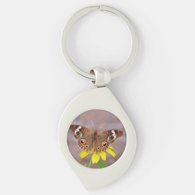 Vacker fjäril på gul blomma  swirl silverfärgad nyckelring (Framsidan)