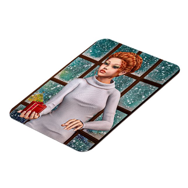 Vacker flicka som håller en julpresent magnet (Vänstra Sidan)