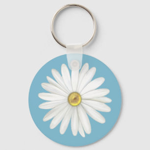 Vacker tusenskönasblomma på turkos teal nyckelring