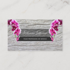 Vacker violet rosa orchid-blommar på träbusi visitkort