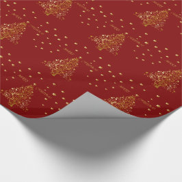 Vackert metallhaltigt guld Julgran på mörk rött Presentpapper