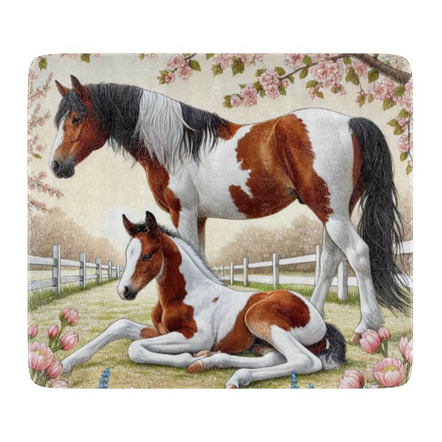 Vackra hästar och föl i en blommande trädgård (Framsidan)